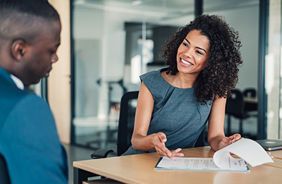 Bank representative reviewing documents.