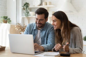 Couple reviewing their credit score using My Credit Score